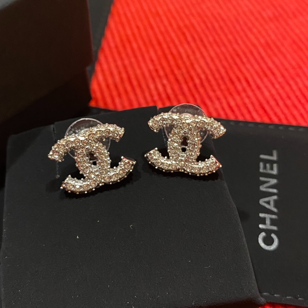 Authentic Chanel CC . Silver Crystal studs earrings